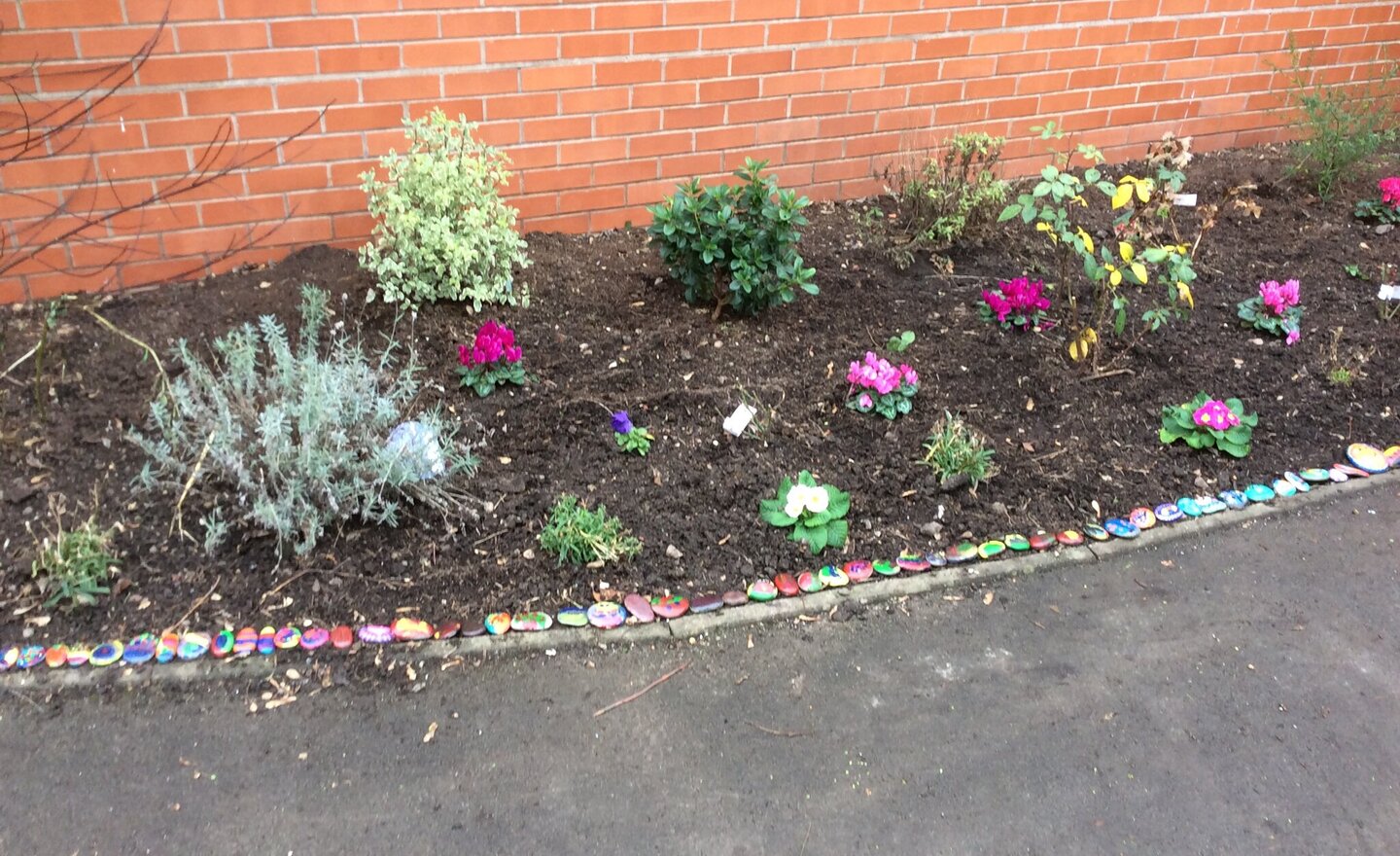 Image of Placing our stones in the Remembrance Garden 