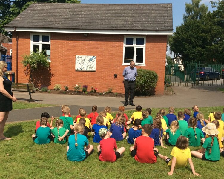 Image of Father Neale blessing our Reflection Garden