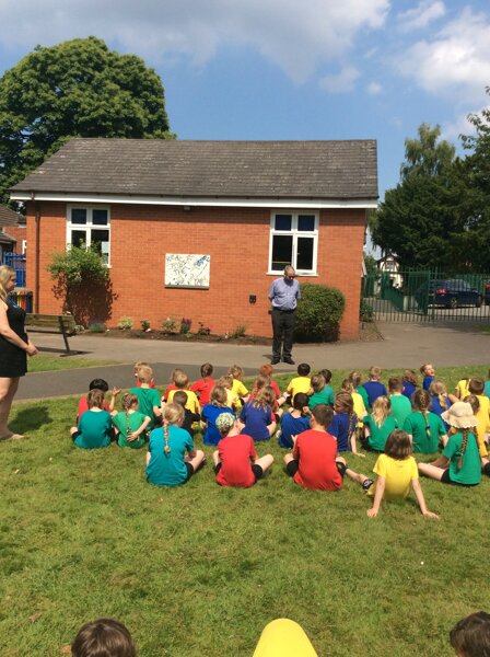 Image of Father Neale blessing our Reflection Garden