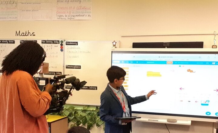 Image of Year 7 pupil filmed by the BBC delivering a coding workshop to primary school pupils