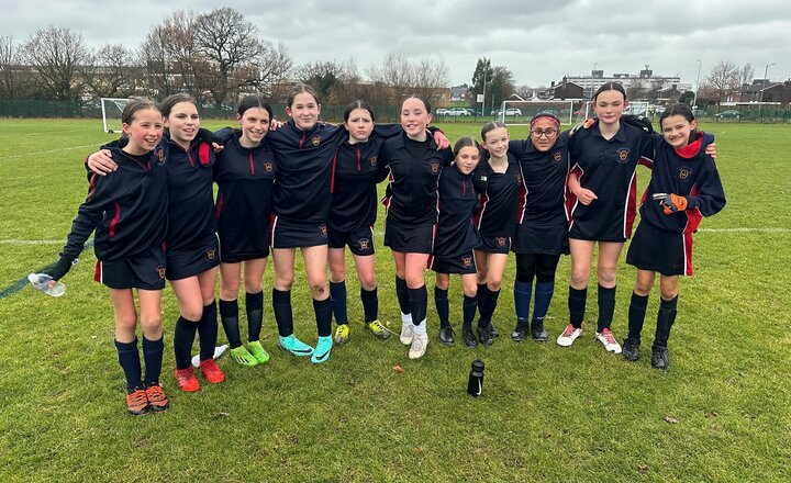 Image of Year 7 girls' football team celebrate in the National Football Cup