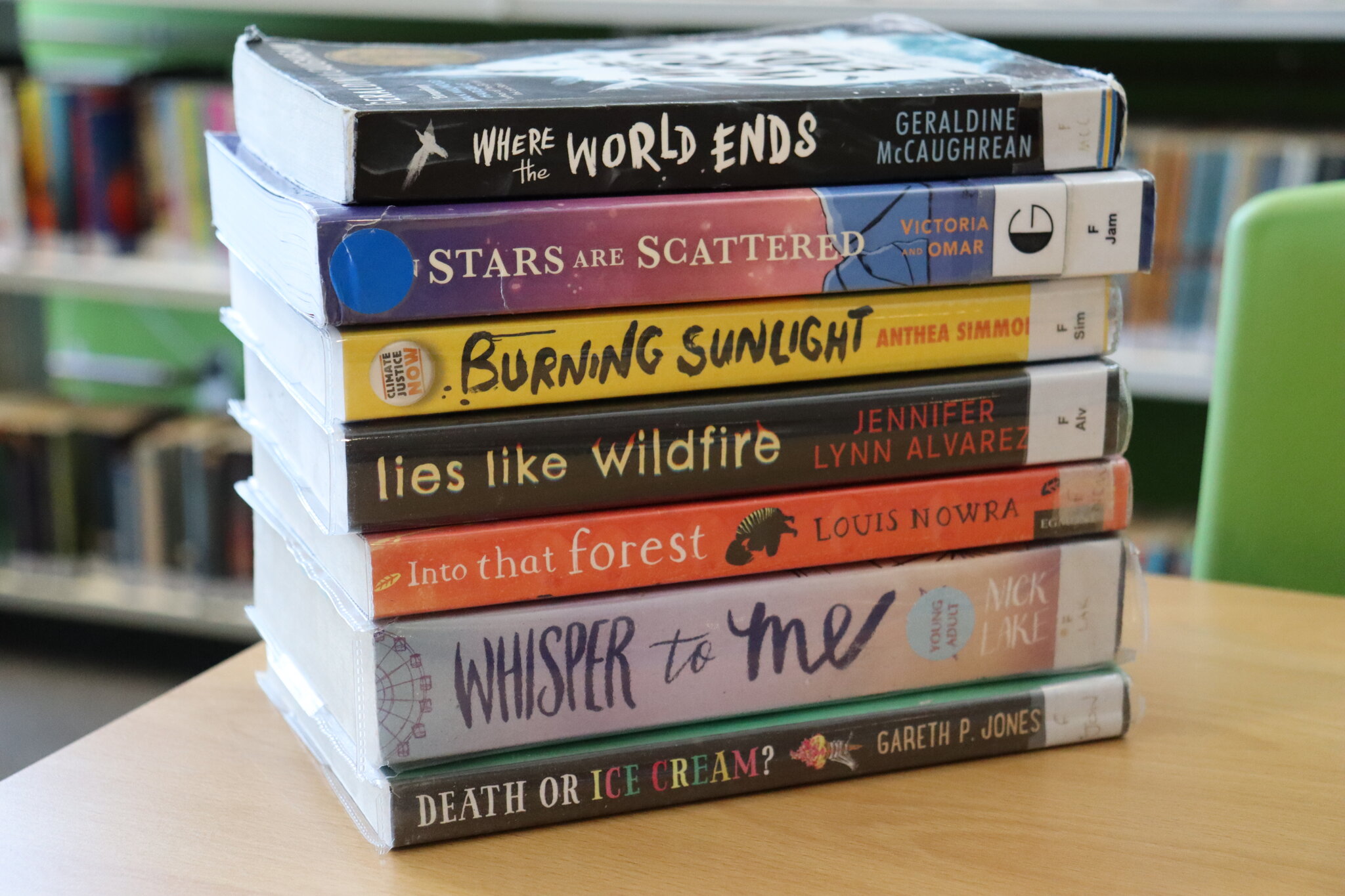 Image of Pupils celebrate National Poetry Day creating book spine poetry in the library