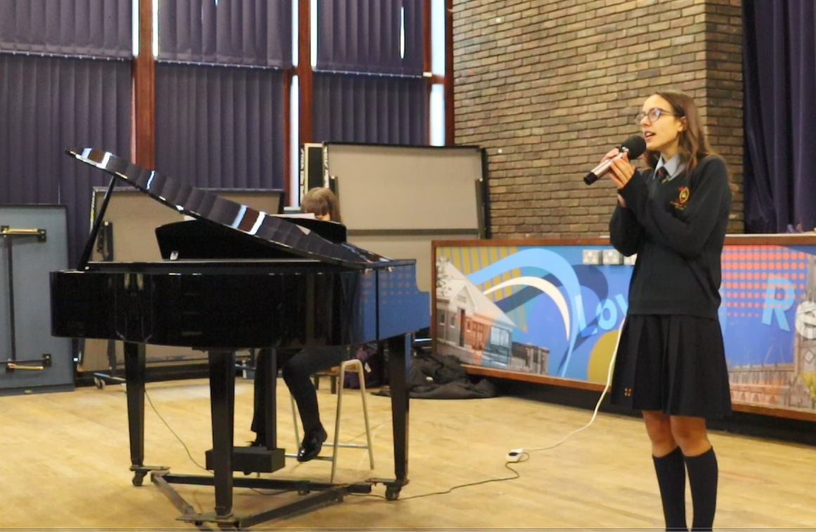 Image of Anna and Ellie perform Amazing Grace in Collective Worship