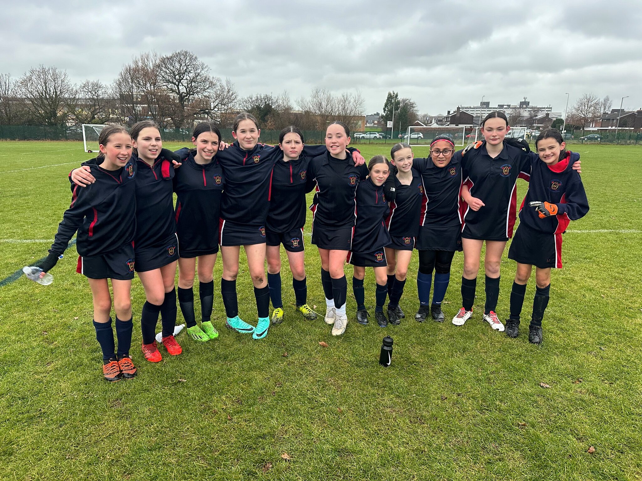 Image of Year 7 girls' football team celebrate in the National Football Cup