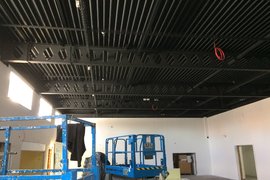 Dining Hall ceiling receiving its first coat of black polymer paint, walls receiving the first coat of paint.