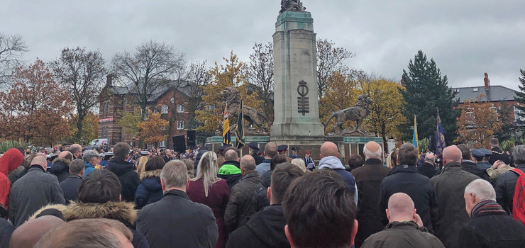 Image of College students lay wreath at Ashton Remembrance Service