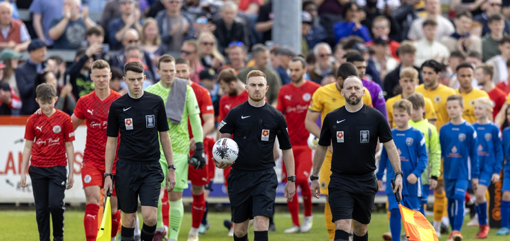 Image of Staff member appointed as Assistant Referee in televised football game