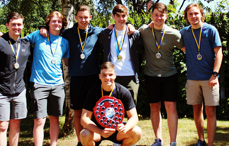 Image of College boys' football team win league title