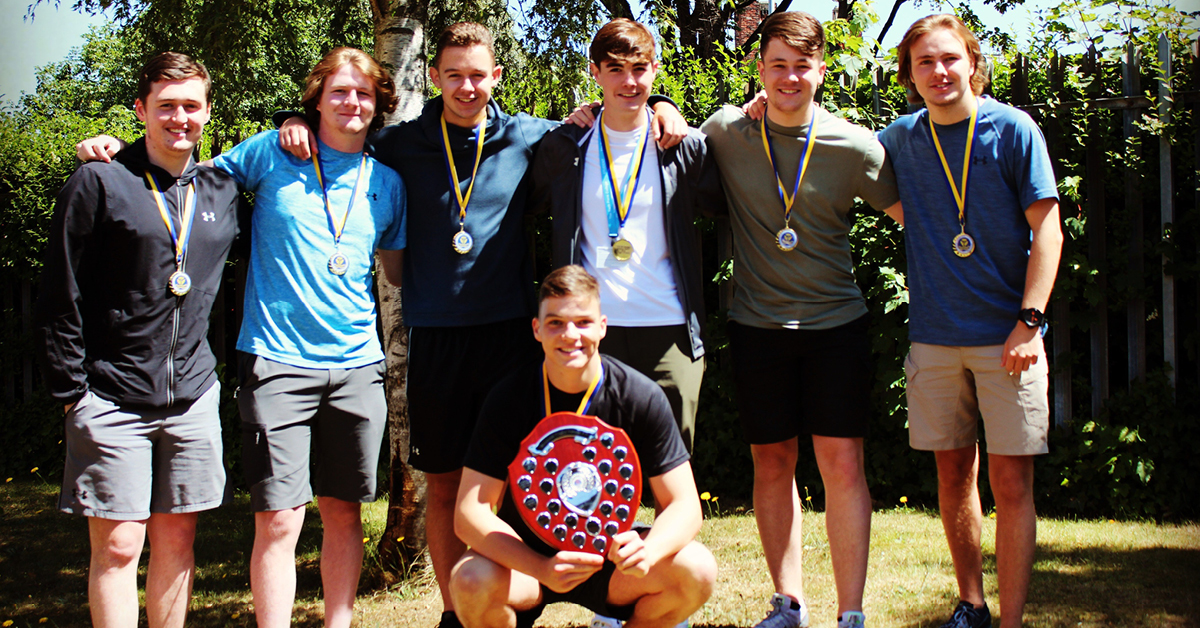 Image of College boys' football team win league title