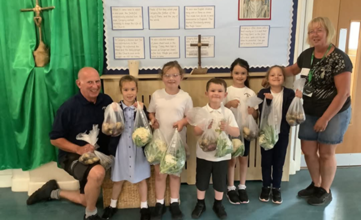 Image of Children learn to Live Simply by growing fruit and veg at school