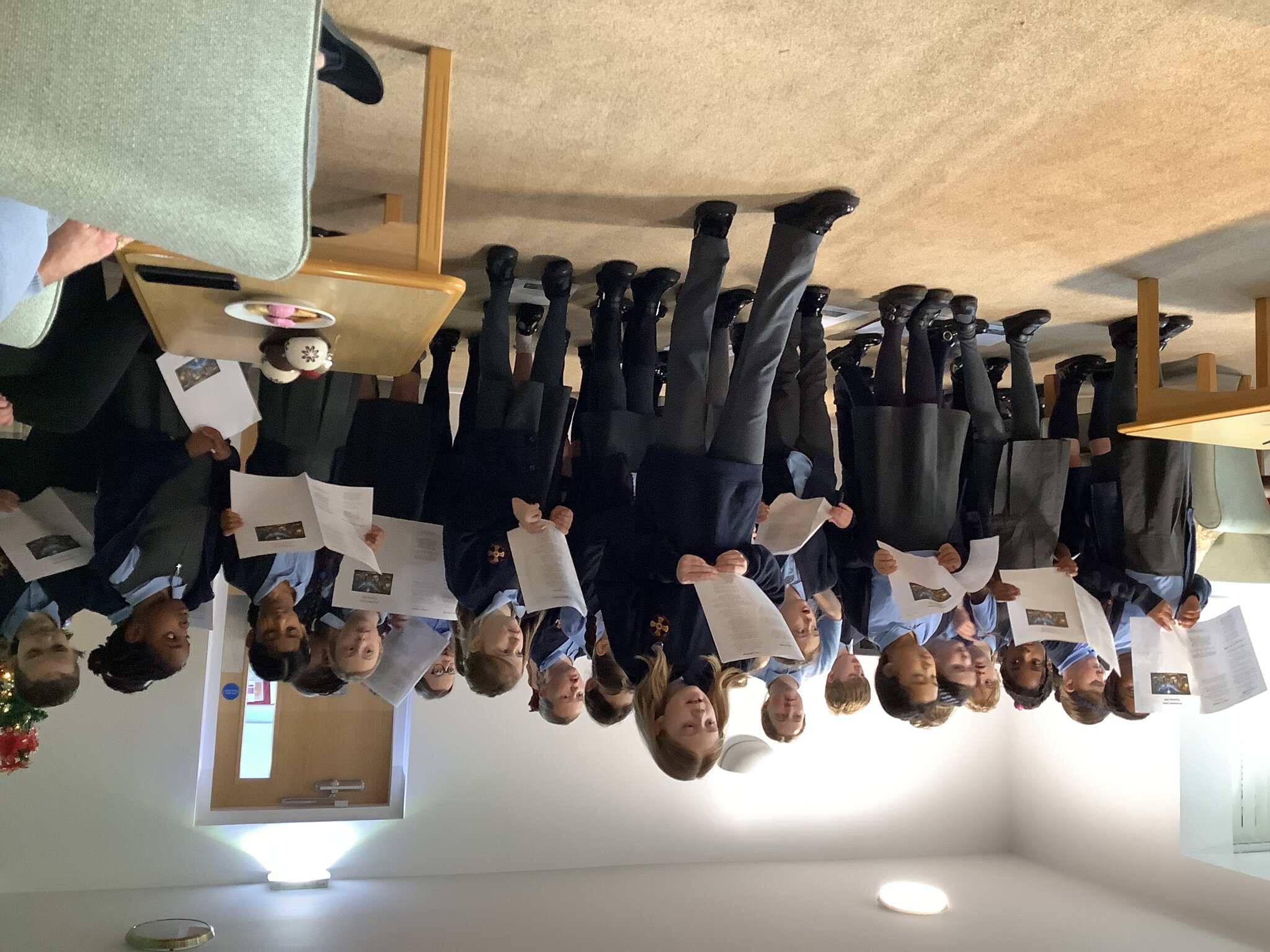 Image of Children sprinkle some festive magic by singing carols to sheltered housing residents