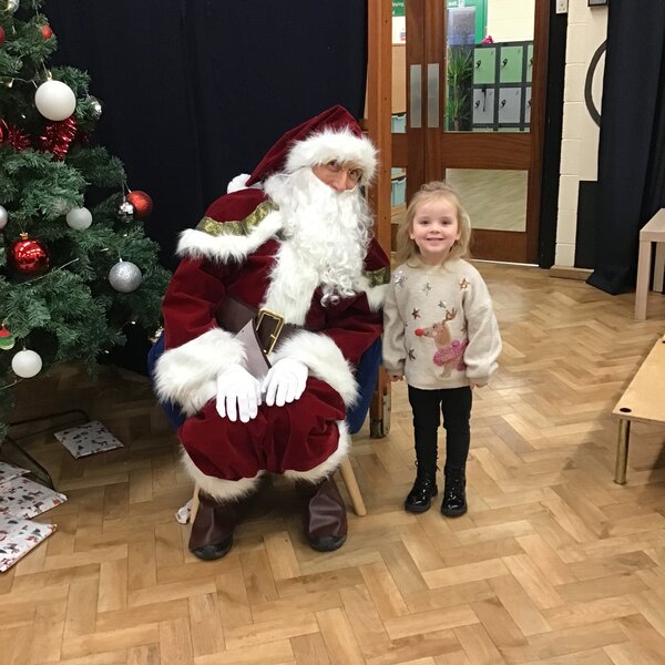 Image of Nursery Singing around the Christmas Tree with Father Christmas