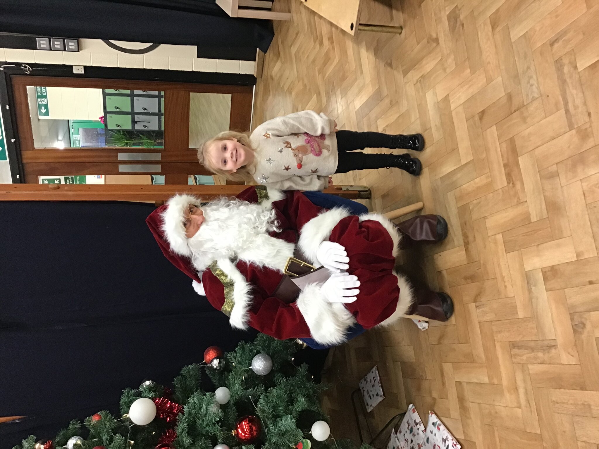 Image of Nursery Singing around the Christmas Tree with Father Christmas