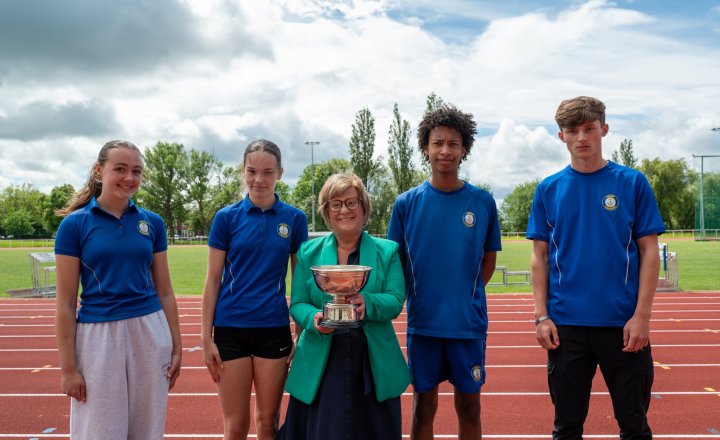 Winning Carmel College students with Yvonne Coates, Chair of Directors