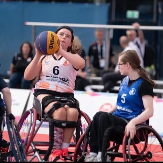 Carmel student Anna playing wheelchair basketball
