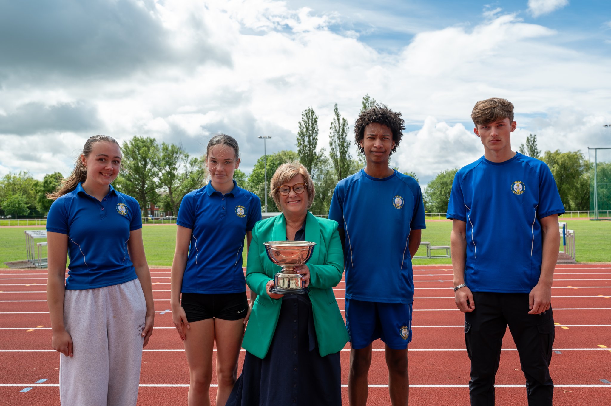 Winning Carmel College students with Yvonne Coates, Chair of Directors
