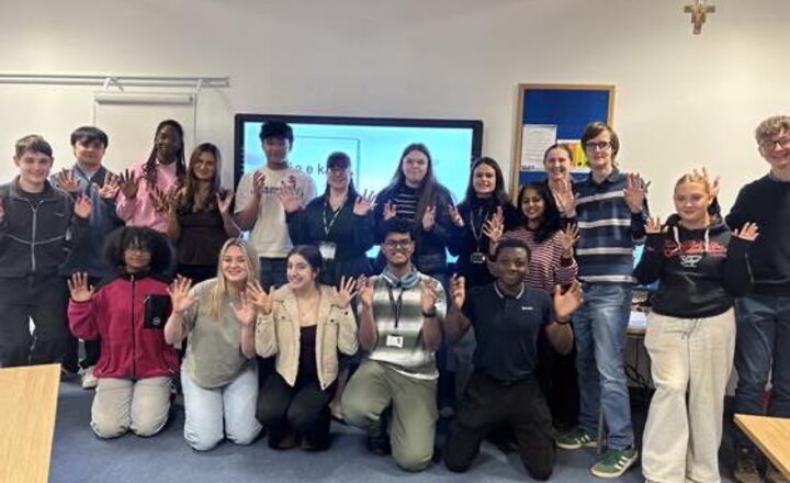Carmel College Year 12 showing their recently learnt sign language for Sign Language Week