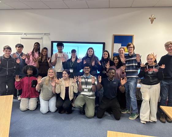 Carmel College Year 12 showing their recently learnt sign language for Sign Language Week