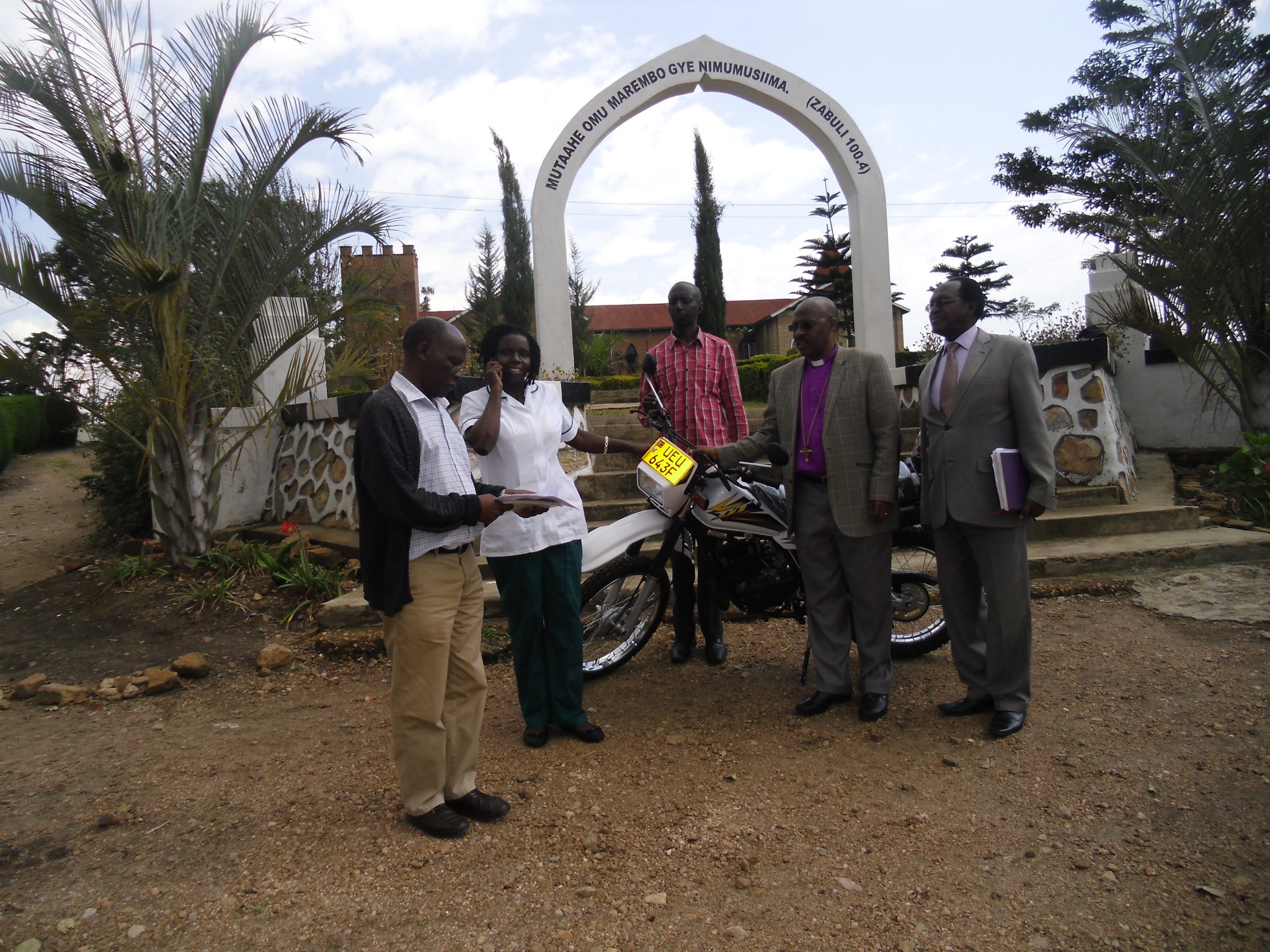 Image of Bishop Benon dedicates the new motorcycle