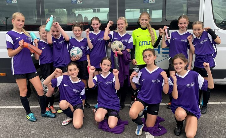 Image of Year 7 and 8 Footballers Celebrate Win in Manchester