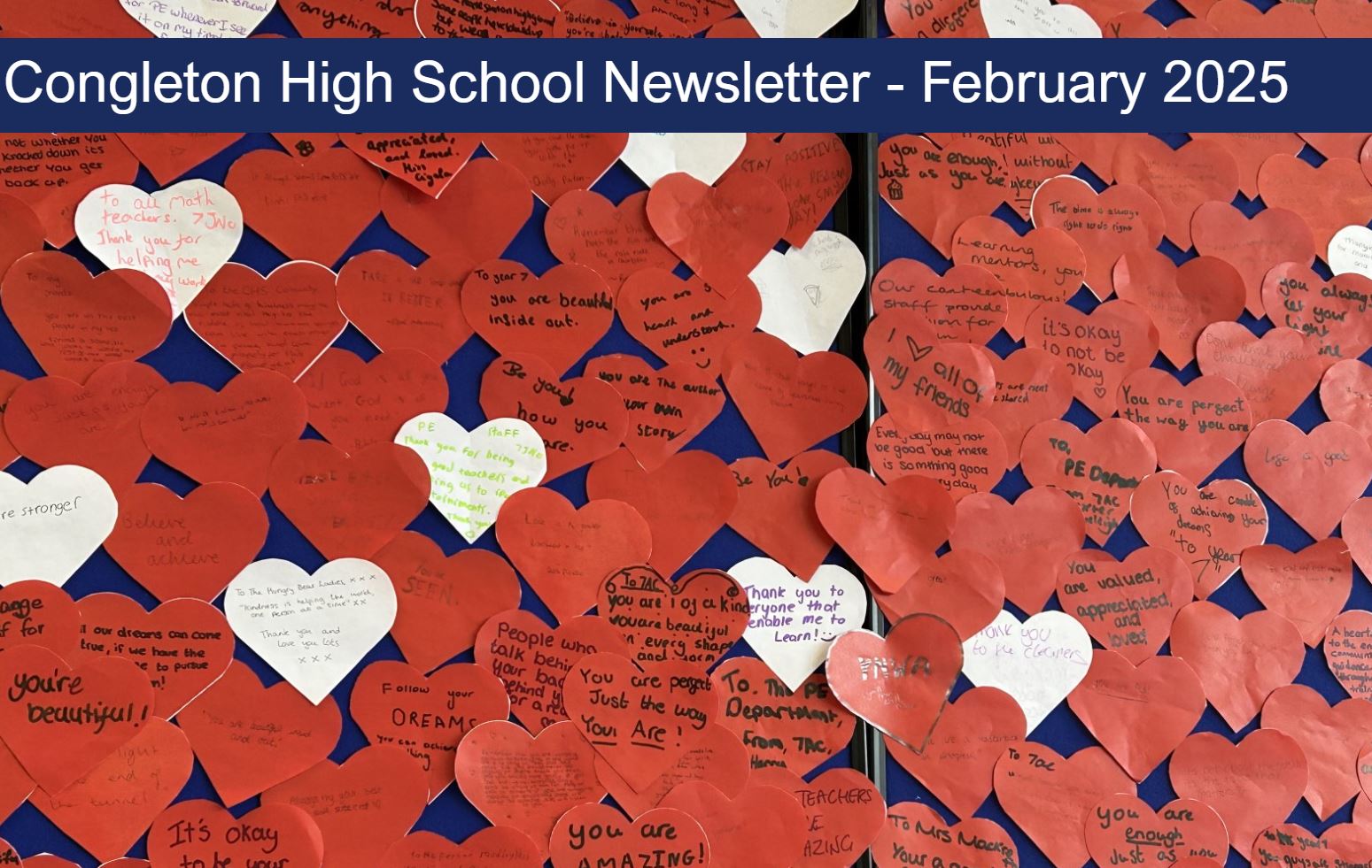 A wall of red hearts with words of support and positive affirmations written on them.