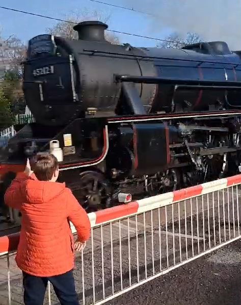 Image of Taylor and Joseph Watch as Stratford Flyer Flies Past!