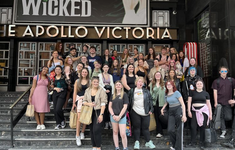 Students outside the Apollo Victoria theatre in London