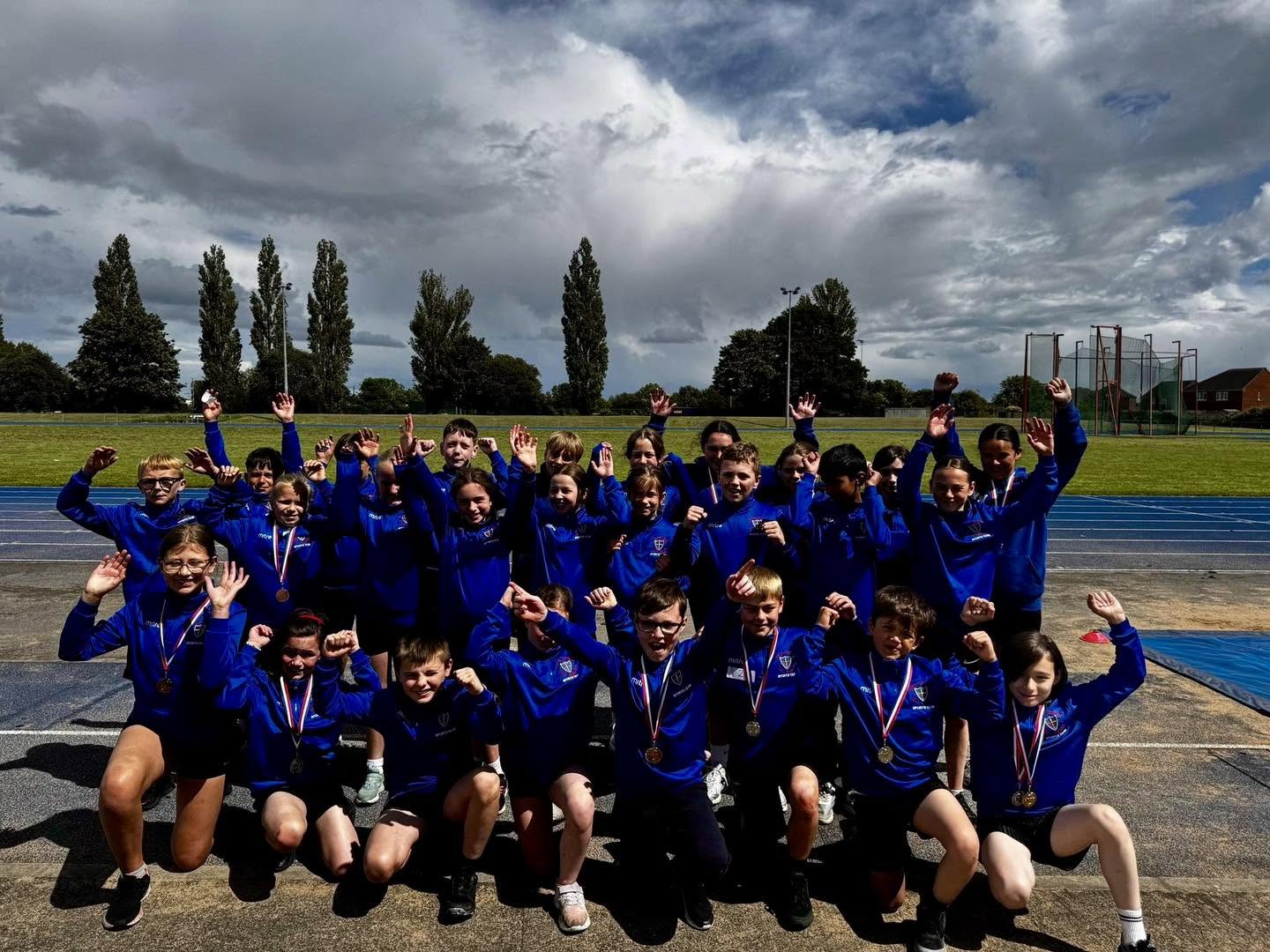Holy Family celebrating their sporting achievement during the Town Sports event