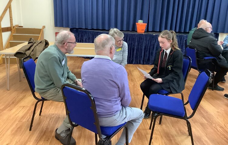 Image of Reading at the village hall with Dementia Caring Charity