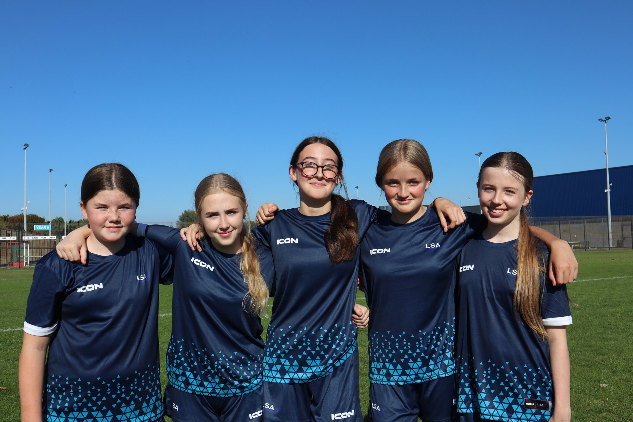 Picture of some of our girls wearing the new football kit.