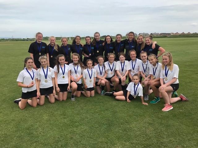 Image of Lytham teams celebrate a district double at Rossall 