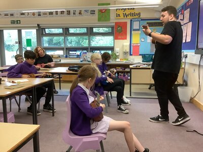 Image of Year 6 children are learning to play the ukulele 