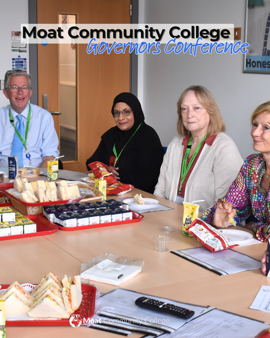 An image of the Principal seated at a large board-room table with three governors. They are pictured enjoying a buffet lunch. Text on the visual reads, ‘Moat Community College – Governors Conference’. The Moat College logo appears in white at the bottom. 