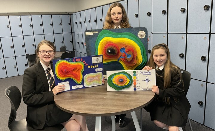 Image of Year 7 line up their models to impress Geography teachers