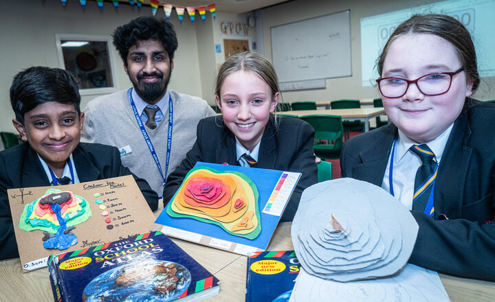 Image of Year 7 pupils line up their models to impress Geography teachers