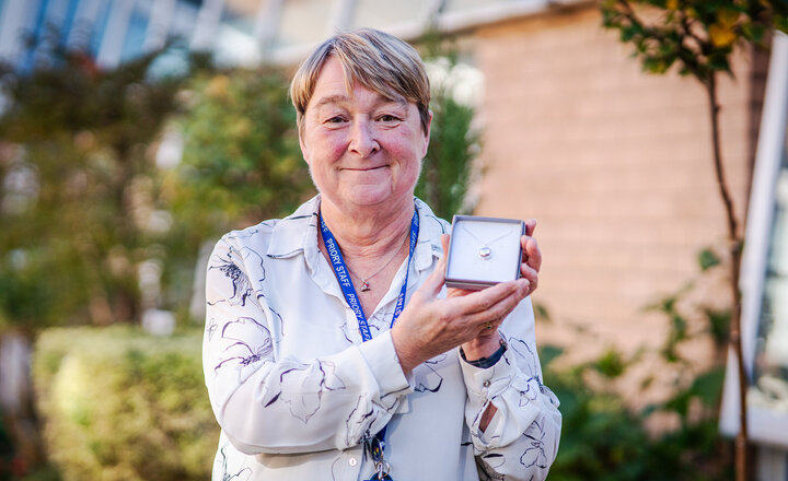Image of Mrs Simpson's Long Service Award Takes Her Back To Former Pupil