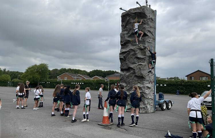 Image of Reaching New Heights:  House Rewards Climbing Wall Experience