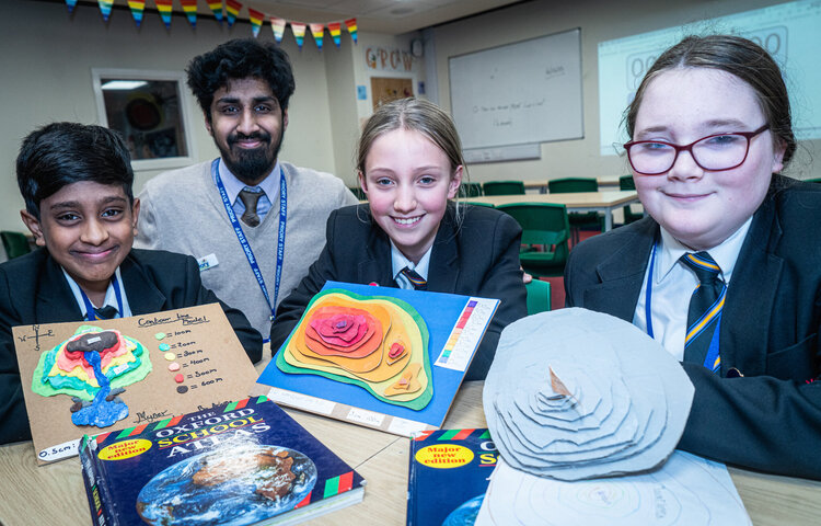 Image of Year 7 pupils line up their models to impress Geography teachers