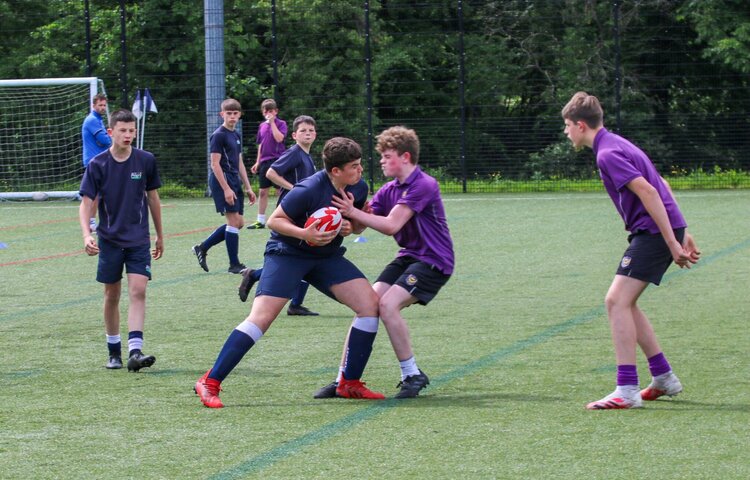 Image of Year 7 & 8 tackle with success at rugby