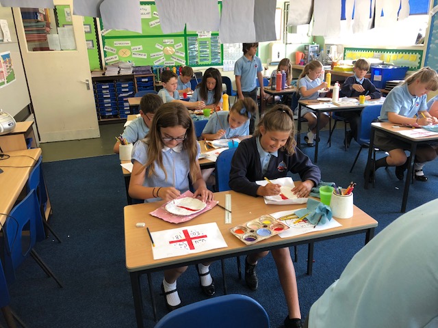 Image of Year 6 decorating their World Cup Modroc Plates
