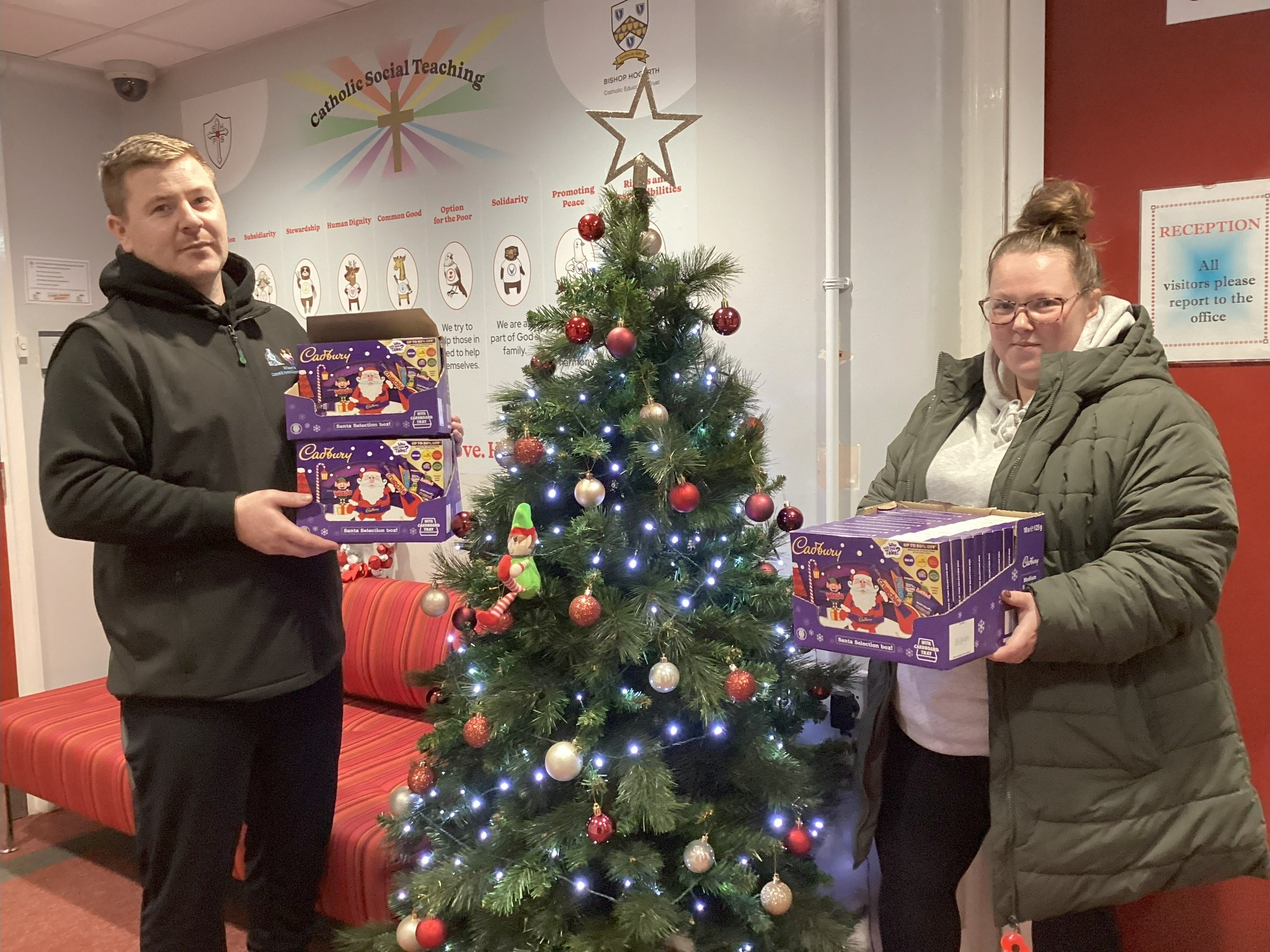 Tesco and Wilson's Carpet & Cleaning Services donate selection boxes for Sacred Hearts fundraiser