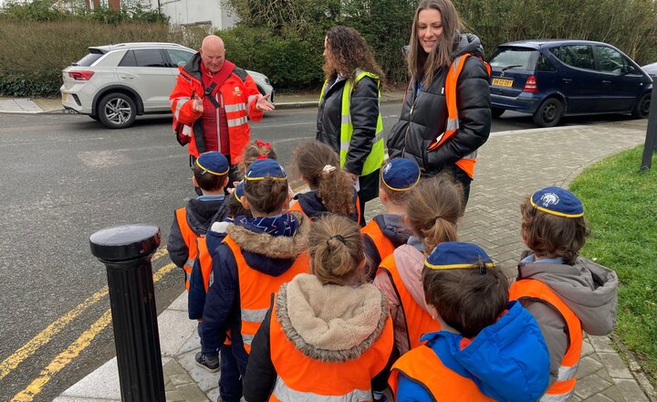 Image of Nursery meet Postman Mark on their trip to the postbox