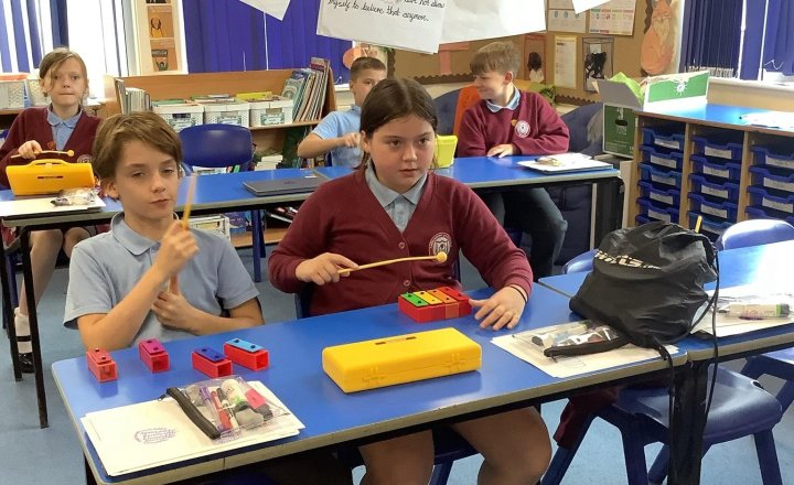 Image of 🎶 A lively junior jam session using the boom whacked and xylophones🗣️