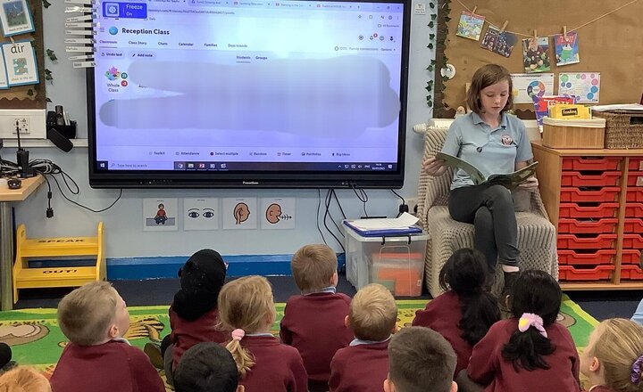 Image of Story time with a year 6 pupil.