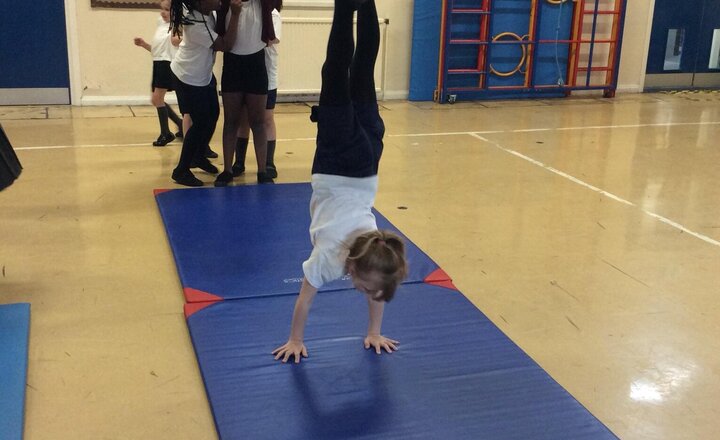 Image of This week in PE we have warmed up by stretching and playing games. Then we used various equipment to support us with a hand stand. Well done, Year 3!