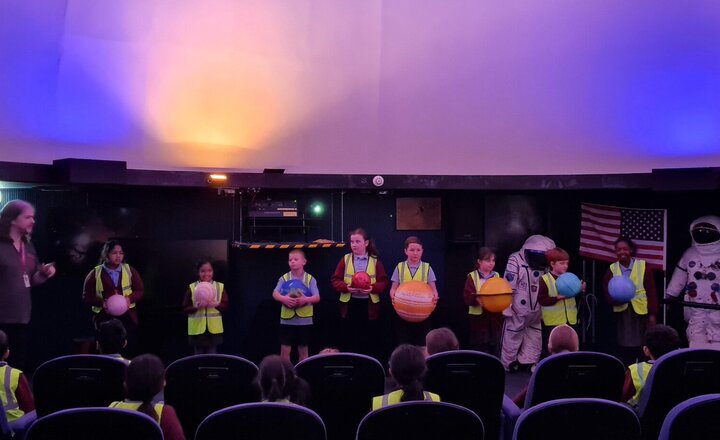 Image of Year 5 are having a blast exploring the wonders of the universe at the planetarium!