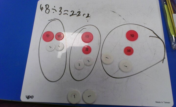 Image of Division with exchange and a remainder.