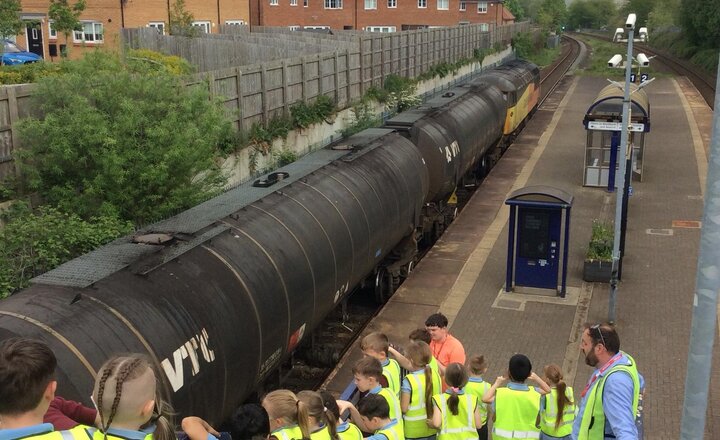 Image of This afternoon, we have been on a local walk to Mill Hill Train Station. the children learnt that the railways are used to transport goods and we spoke about the changes through the years. A freight train even came past.