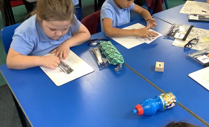 Image of Today we have had an English experience day with our story of The Stone Age Boy. We have had a look at cave painting and had a little go ourselves using the medium of charcoal.