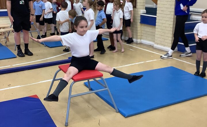 Image of This term we have Blackburn Rovers in to teach us Gymnastics. Today we have warmed up by stretching and playing games. Then we used various equipment to balance and jump in different shapes. Well done Year 3!